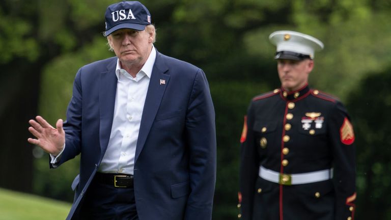 US President Donald Trump waves as he walks from Marine One at the White House on May 3, 2020 in Washington, DC after returning from Camp David. 