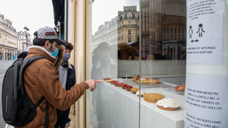 Clients are queueing in front of the Cedric Grolet bakery shop on Avenue de l'Opera