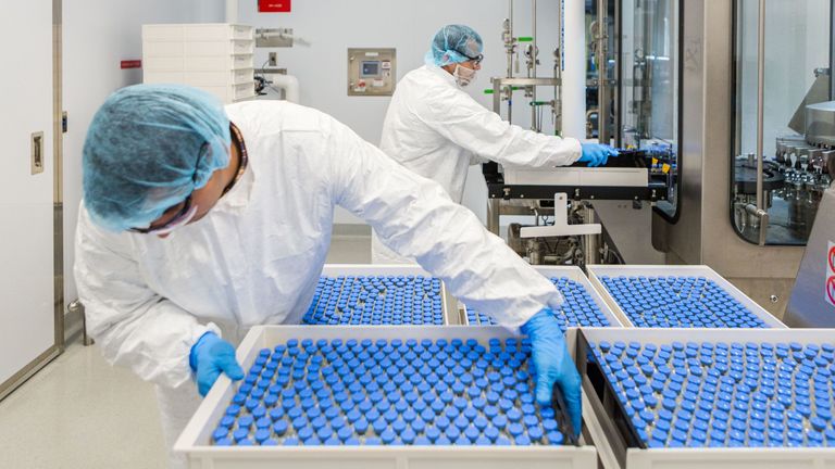 Lab technicians load filled vials of investigational coronavirus disease (COVID-19) treatment drug remdesivir at a Gilead Sciences facility in La Verne, California, U.S. March 18, 2020. Pic: Gilead Sciences