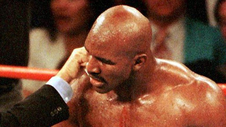 June 1997: Blood pours from the ears of Holyfield after being bitten by Tyson