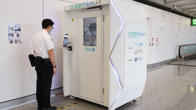 Hong Kong airport is trialling a full-body disinfectant booth. Pic: Hong Kong International Airport