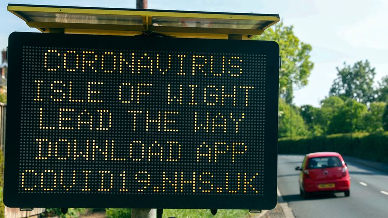 A sign telling people in the Isle of Wight to download the NHS coronavirus contact tracing app