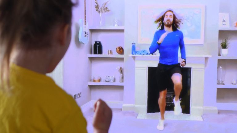 Four-year-old Lois Copley-Jones takes part in a live streamed broadcast of PE with fitness trainer Joe Wicks