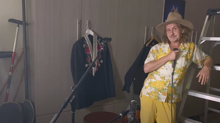 Mark Owen appeared to perform from his garage. Pic: Youtube/ Comparethemeerkat