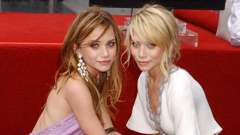 Mary-Kate Olsen and Ashley Olsen during Mary-Kate Olsen and Ashley Olsen Honored with a Star on the Hollywood Walk of Fame for Their Achievements in Television at Hollywood Boulevard in Hollywood, California, United States. (Photo by Gregg DeGuire/WireImage)