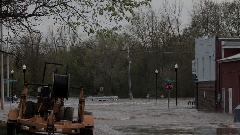 Floodwaters are seen along a street in downtown Sanford, Michigan