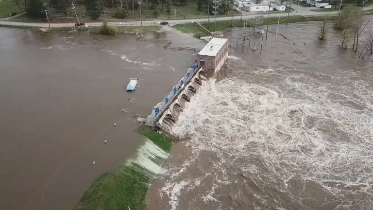 An aerial view of flooding as water overruns Sanford Dam, Michigan