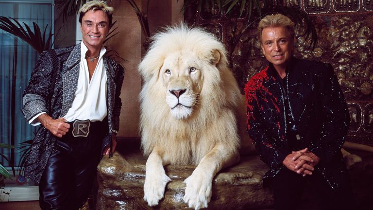 Horn and Fischbacher in their private apartment at the Mirage Hotel on the Vegas Strip, with one of their performing white lions in 2011