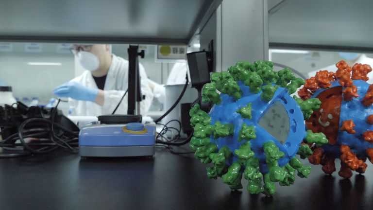 A worker at Beijing-based biotech company Sinovac, where work is taking place to create a coronavirus vaccine