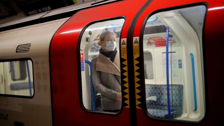 A commuter wearing a face mask on the London Underground on Monday morning