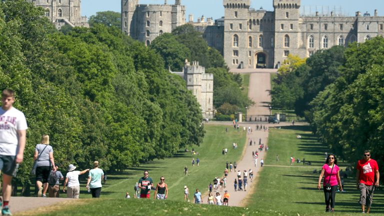 People enjoy the hot weather on the Long Walk at Windsor Castle, Berkshire, as people flock to parks and beaches with lockdown measures eased.