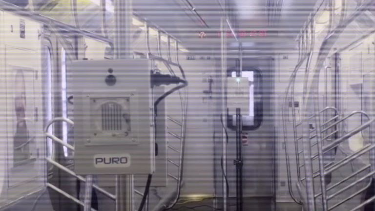 Ultraviolet light being used to disinfect a New York subway train 