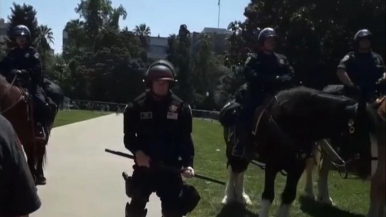 Police dressed in riot gear and atop horses closely monitored the anti-lockdown protests at the California State Capitol building on May 1, as demonstrators rallied against Governor Gavin Newsom and policies enacted amid the coronavirus pandemic.
