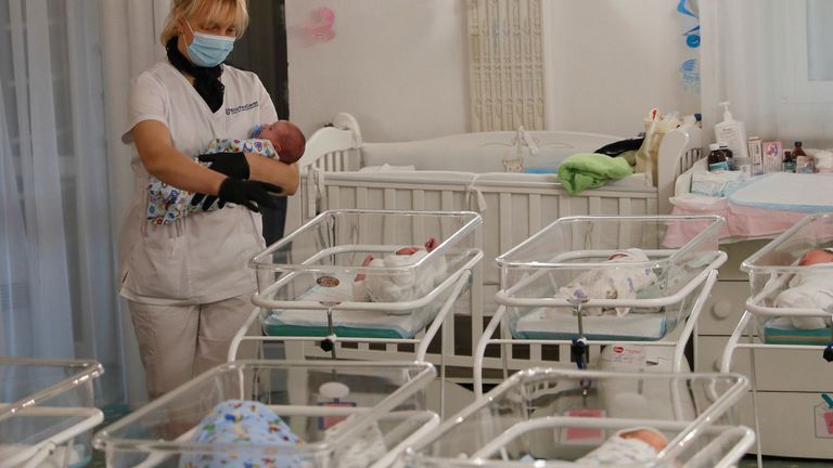A nurse and newborns are seen in the Hotel Venice owned by BioTexCom clinic in Kiev, Ukraine May 14, 2020. At least fifty babies born to surrogate mothers are stranded in a Ukrainian clinic as the coronavirus disease (COVID-19) lockdown prevents their foreign parents from collecting them. Picture taken May 14, 2020