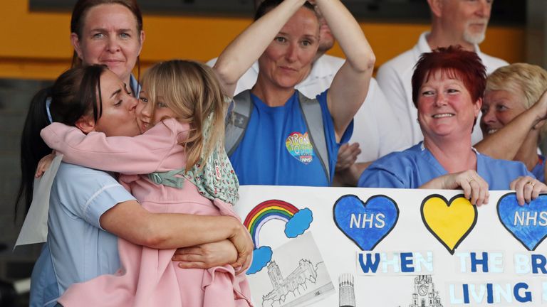 Supporters and NHS staff from Aintree University Hospital in Liverpool join in the applause to salute local heroes during Thursday&#39;s nationwide Clap for Carers to recognise and support NHS workers and carers fighting the coronavirus pandemic.