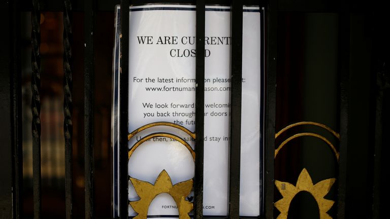 A notice is seen on a door at Fortnum & Mason, the department store in London&#39;s Piccadilly, pictured after it was reported to be furloughing 700 employees while the spread of the coronavirus disease (COVID-19) continues, in London, Britain April 9, 2020. REUTERS/Henry Nicholls
