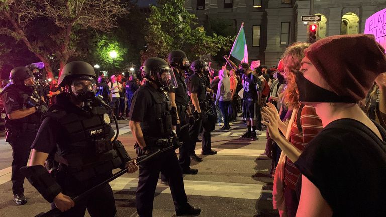 Demonstrators face off with police in riot gear near the Capitol building, to protest Monday&#39;s killing of African-American man George Floyd in Minneapolis by a white police officer, in Denver, Colorado, U.S., May 28, 2020 in this image obtained from social media. Picture taken May 28, 2020. Courtesy of Madison Lauterbach/Ms. Mayhem Magazine/@MsMayhem_Mag via REUTERS THIS IMAGE HAS BEEN SUPPLIED BY A THIRD PARTY. MANDATORY CREDIT. NO RESALES. NO ARCHIVES
