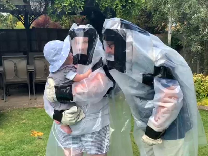Coronavirus: Couple create 'hugging suit' to see grandchildren ...
