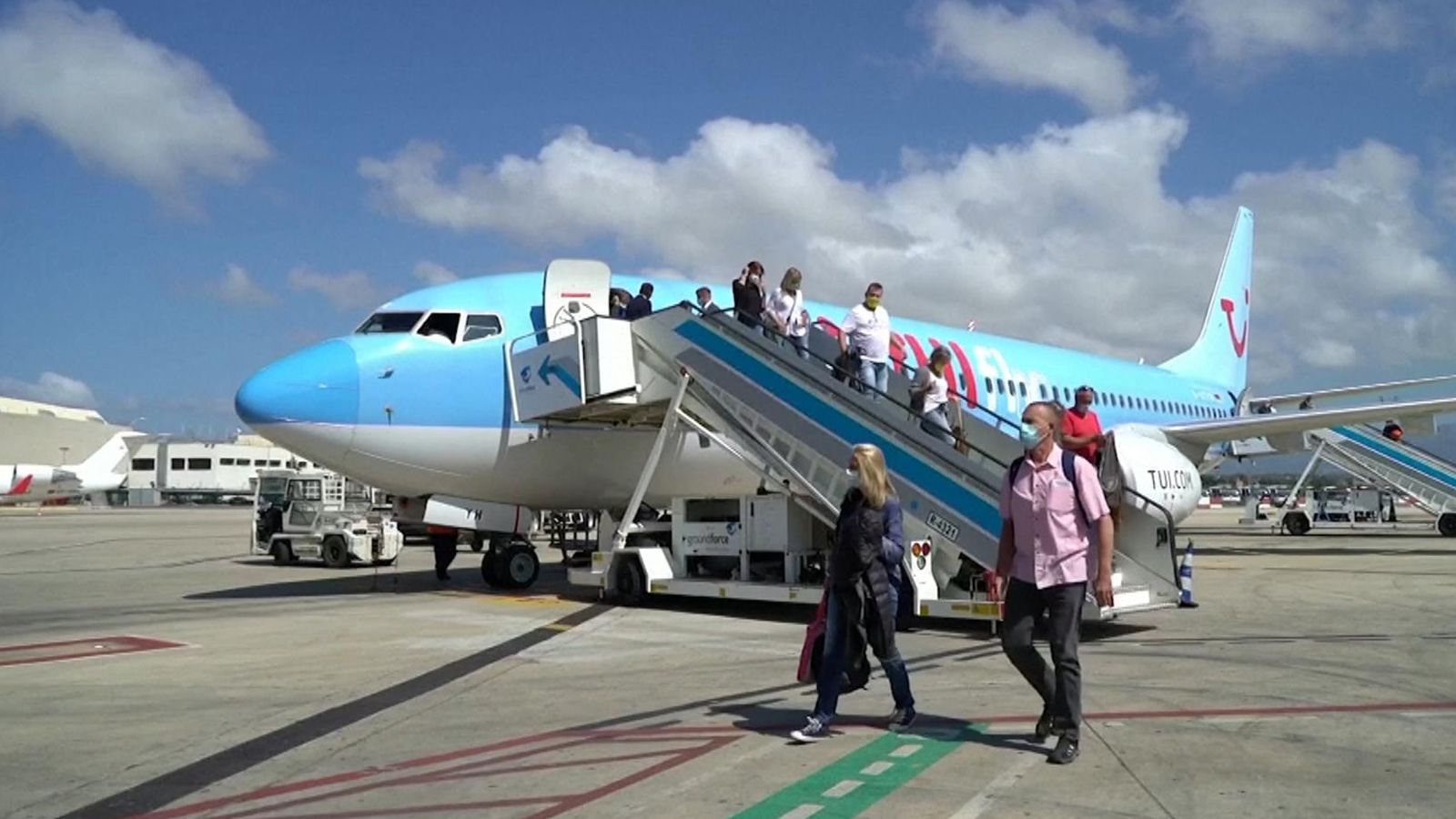 Coronavirus German tourists arrive on first flight to Spain for 'safe