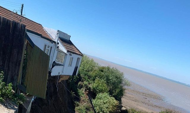 Kent: House falls over cliff edge after part of coastline collapses