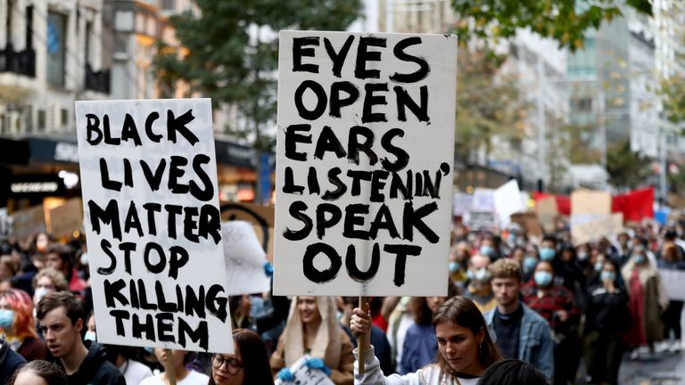 AUCKLAND, NEW ZEALAND - JUNE 01: Protestors march down Queen Street on June 01, 2020 in Auckland, New Zealand. The rally was organised in solidarity with protests across the United States following the killing of an unarmed black man George Floyd at the hands of a police officer in Minneapolis, Minnesota.  (Photo by Hannah Peters/Getty Images)