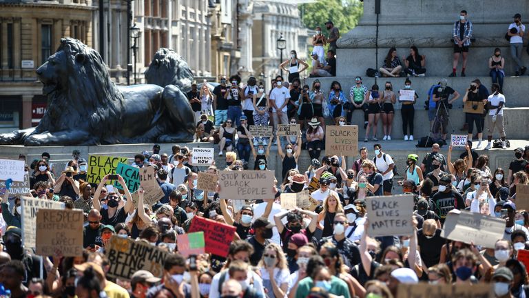 LONDON, ENGLAND - MAY 31: People hold placards as they join a spontaneous Black Lives Matter march at Trafalgar Square to protest the death of George Floyd in Minneapolis and in support of the demonstrations in North America on May 31, 2020 in London, England. The death of an African-American man, George Floyd, at the hands of police in Minneapolis has sparked violent protests across the USA. A video of the incident, taken by a bystander and posted on social media, showed Floyd's neck being pinned to the ground by police officer, Derek Chauvin, as he repeatedly said "I can’t breathe". Chauvin was fired along with three other officers and has been charged with third-degree murder and manslaughter. (Photo by Hollie Adams/Getty Images)