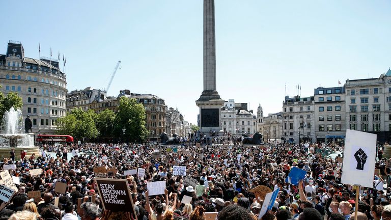 LONDON, ENGLAND - MAY 31: People hold placards as they join a spontaneous Black Lives Matter march at Trafalgar Square to protest the death of George Floyd in Minneapolis and in support of the demonstrations in North America on May 31, 2020 in London, England. The death of an African-American man, George Floyd, at the hands of police in Minneapolis has sparked violent protests across the USA. A video of the incident, taken by a bystander and posted on social media, showed Floyd's neck being pinned to the ground by police officer, Derek Chauvin, as he repeatedly said "I can’t breathe". Chauvin was fired along with three other officers and has been charged with third-degree murder and manslaughter. (Photo by Hollie Adams/Getty Images)