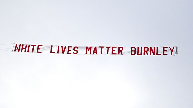 A plane flies over the stadium with a banner reading 'White Lives Matter Burnley' during the Premier League match at the Etihad Stadium, Manchester.