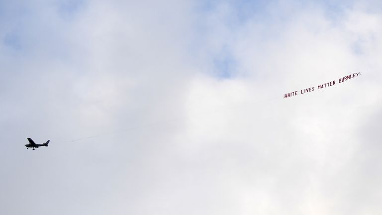 A plane flies over the stadium with a banner reading &#39;White Lives Matter Burnley&#39; during the Premier League match at the Etihad Stadium, Manchester.