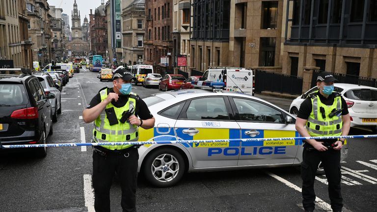 GLASGOW, SCOTLAND - JUNE 26: Police officers at the scene after reports of three people being killed in a central Glasgow hotel on June 26, 2020 in Glasgow, Scotland. A knifeman stabbed three people to death in the stairwell of the Park Inn Hotel on West George Street, Glasgow before being shot himself by armed police. The Scottish Police Federation (SPF) said an officer was stabbed during the major incident. (Photo by Jeff J Mitchell/Getty Images)
