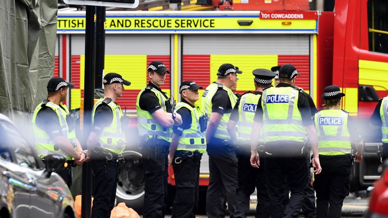 GLASGOW, SCOTLAND - JUNE 26: Police officers stand in front of a cordoned off area after reports of three people being killed in a central Glasgow hotel on June 26, 2020 in Glasgow, Scotland. A knifeman stabbed three people to death in the stairwell of the Park Inn Hotel on West George Street, Glasgow before being shot himself by armed police. The Scottish Police Federation (SPF) said an officer was stabbed during the major incident. (Photo by Jeff J Mitchell/Getty Images)