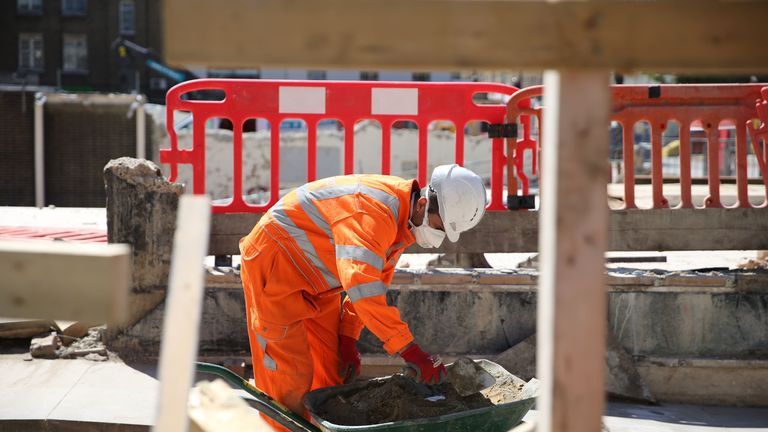 A worker is seen at work on the HS2 building site at Euston in London on May 6, 2020 as life continues under a nationwide lockdown imposed to slow the spread of the novel coronavirus. - Britain's construction sector suffered a record drop in activity during April as the coronavirus pandemic shut sites, data showed Wednesday alongside news of surging food sales at online supermarket Ocado. (Photo by ISABEL INFANTES / AFP) (Photo by ISABEL INFANTES/AFP via Getty Images)