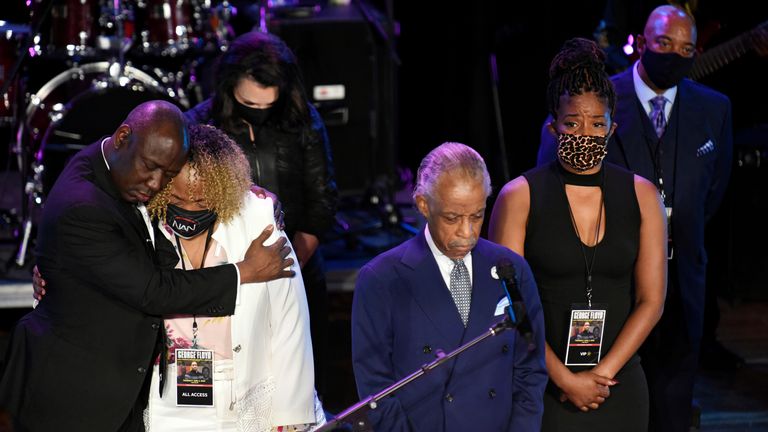 Reverend Al Sharpton leads a moment of silence during the memorial 