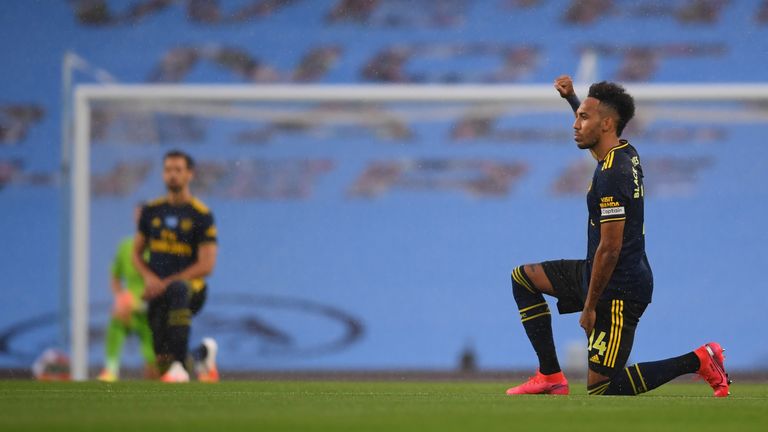 MANCHESTER, ENGLAND - JUNE 17: Pierre-Emerick Aubameyang of Arsenal takes a knee in support of the Black Lives Matter movement prior to the Premier League match between Manchester City and Arsenal FC at Etihad Stadium on June 17, 2020 in Manchester, United Kingdom. (Photo by Laurence Griffiths/Getty Images)