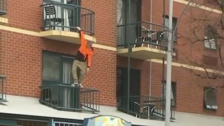 A man was arrested after he climbed down from a fourth-floor balcony to escape police in Adelaide, South Australia, on June 16.