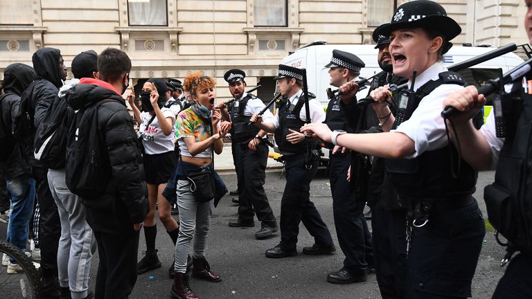 Protesters and police officers during a Black Lives Matter protest rally on Whitehall