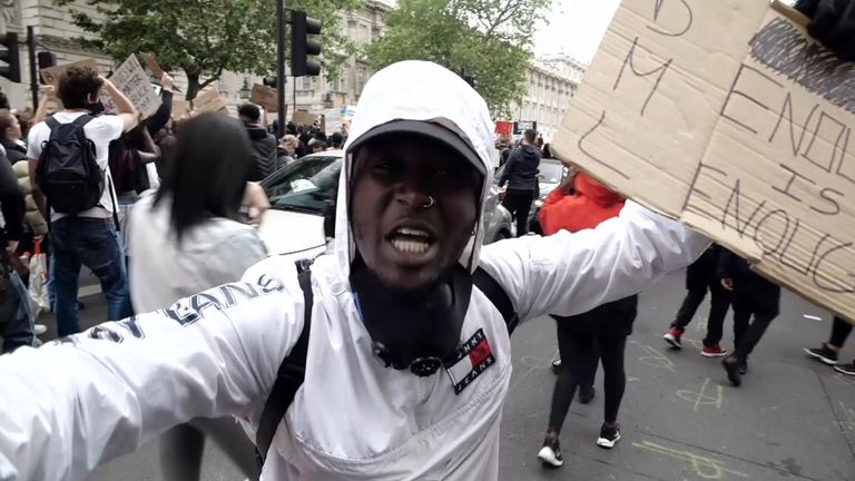 A protester demands justice for the death of George Floyd outside Downing Street.