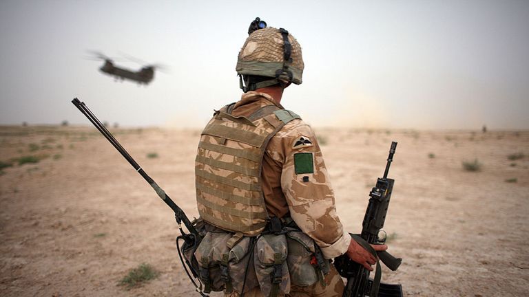 BAND E TIMOR, AFGHANISTAN - AUGUST 6: A British Army soldier from the 3rd Battalion The Parachute Regiment secures the helicopter landing strip (HLS) during operation Southern Beast on August 6, 2008 in Maywand District in Kandahar Province, Afghanistan. The British Army soldiers from the 3rd Battalion The Parachute Regiment spearheaded a strike operation in the Maywand District of the Kandahar Province, setting the conditions for a permanent ISAF presence to support the Afghan National Governme