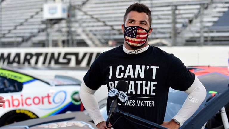 NASCAR Cup Series Blue-Emu Maximum Pain Relief 500
MARTINSVILLE, VIRGINIA - JUNE 10: Bubba Wallace, driver of the #43 Richard Petty Motorsports Chevrolet, wears a "I Can&#39;t Breathee - Black Lives Matter" t-shirt under his fire suit in solidarity with protesters around the world taking to the streets after the death of George Floyd on May 25, speaks to the media prior to the NASCAR Cup Series Blue-Emu Maximum Pain Relief 500 at Martinsville Speedway on June 10, 2020 in Martinsville, Virginia. (Pho