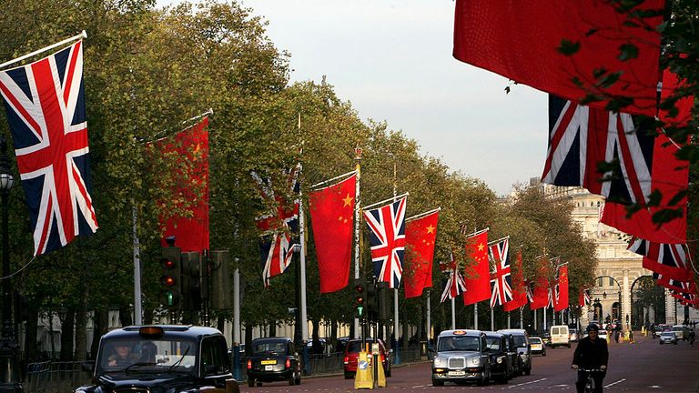 LONDON - NOVEMBER 07:  Chinese and British flags fly on Pall Mall on November 7, 2005 in London, England. The Chinese President, Hu Jintao will make a state 3 day visit to Britain on November 8. The last Chinese president to have visited was Jiang Zemin in October 1999.  (Photo by Daniel Berehulak/Getty Images)