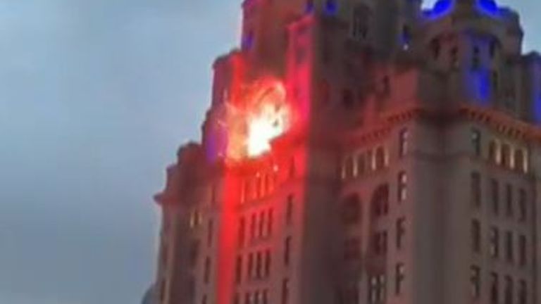 Flare hits Liver Building during Liverpool FC  fan celebrations