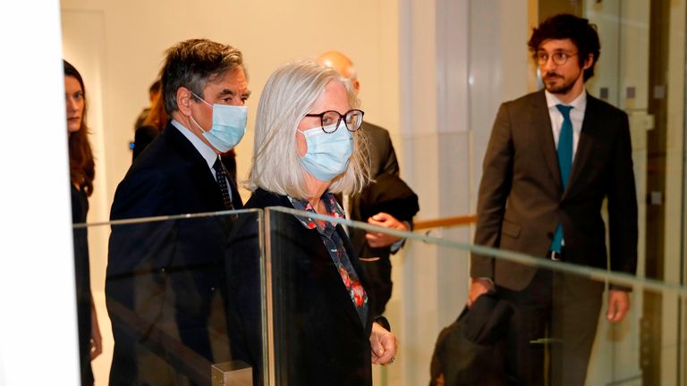 Francois Fillon (L) and his wife Penelope Fillon arrive at court ahead of their conviction for fraud