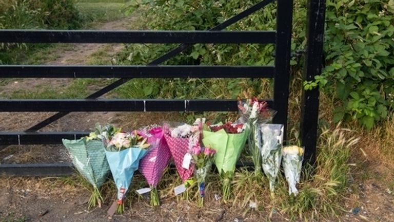 Flowers left at Fryent Country Park, where the sisters were found dead