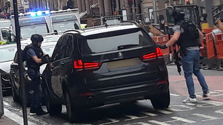 Photo taken with permission from the Twitter feed of @ThatReilz of police presence in West George Street, Glasgow, as a serious police incident has closed roads in the city centre.