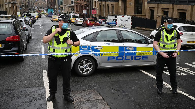 GLASGOW, SCOTLAND - JUNE 26: Police officers at the scene after reports of three people being killed in a central Glasgow hotel on June 26, 2020 in Glasgow, Scotland. A knifeman stabbed three people to death in the stairwell of the Park Inn Hotel on West George Street, Glasgow before being shot himself by armed police. The Scottish Police Federation (SPF) said an officer was stabbed during the major incident. (Photo by Jeff J Mitchell/Getty Images)