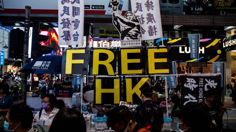 A display showing the Goddess of Democracy and lettering that reads &#39;Free HK&#39; is seen a stall near Victoria Park
