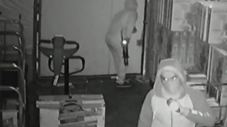 CCTV images show two men wearing hoods and face coverings break into the business unit in Ilford, east London