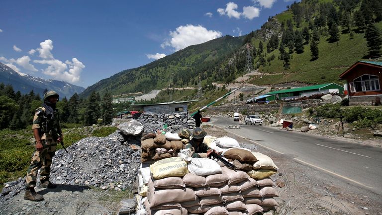 Indian soldiers stand guard at a checkpoint along a road leading to Ladakh at Gagangeer in Kashmir&#39;s Ganderbal district. Pic: Reuters/Danish Ismail