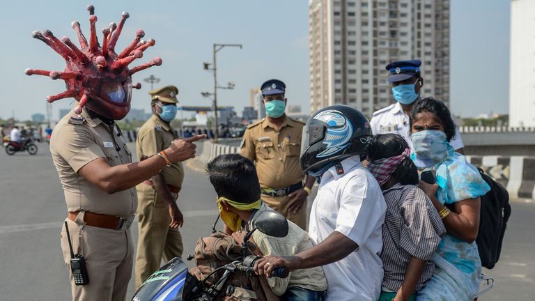Some police in India wear coronavirus-themed helmets