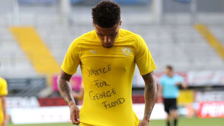 English midfielder Jadon Sancho shows a "Justice for George Floyd" shirt after scoring